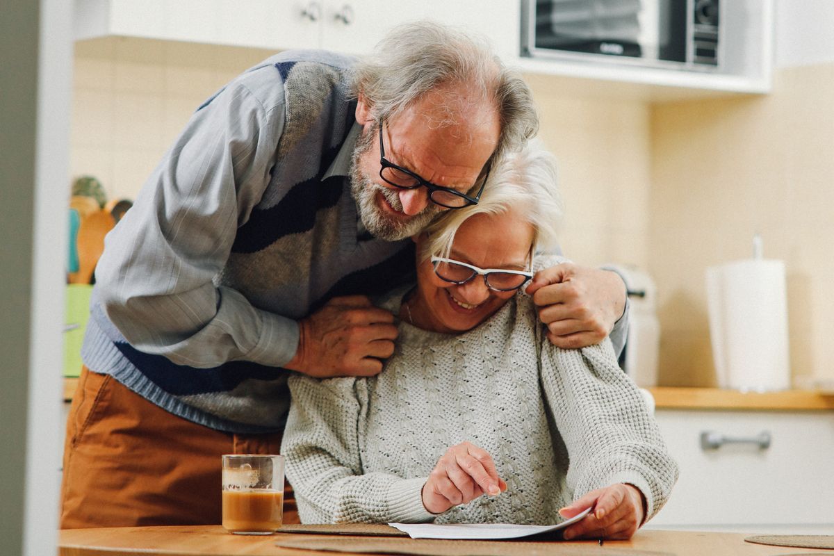 Pensioner couple looking at finances