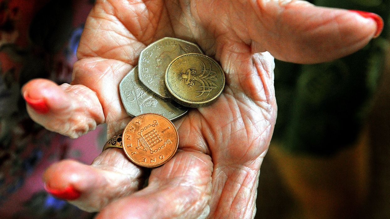 Pensioner holding coins