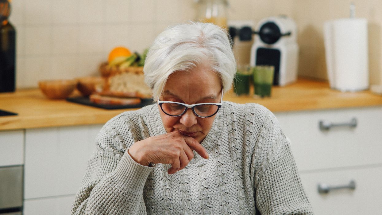 Pensioner looking at document