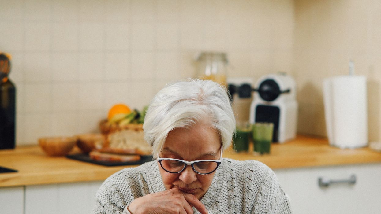 Pensioner looking at document