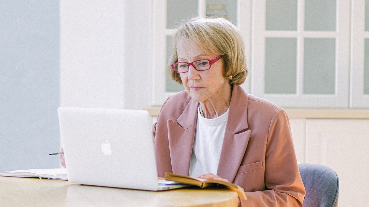 Pensioner looks at laptop