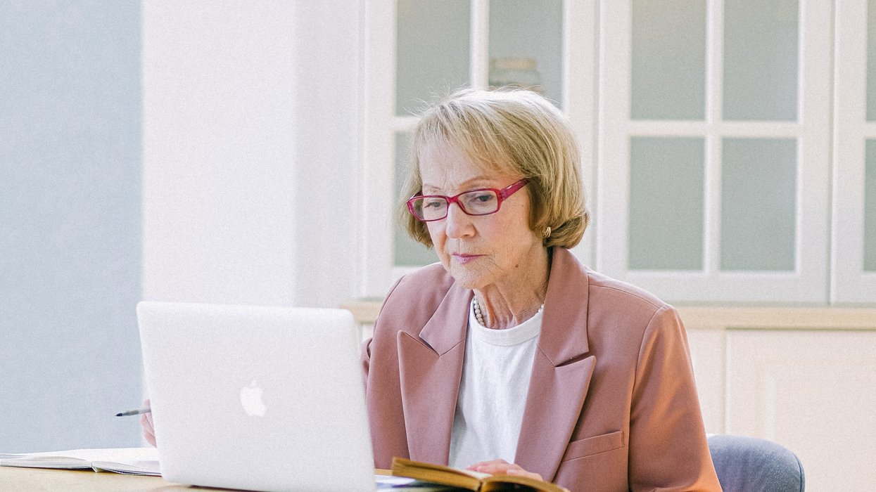 Pensioner looks at laptop
