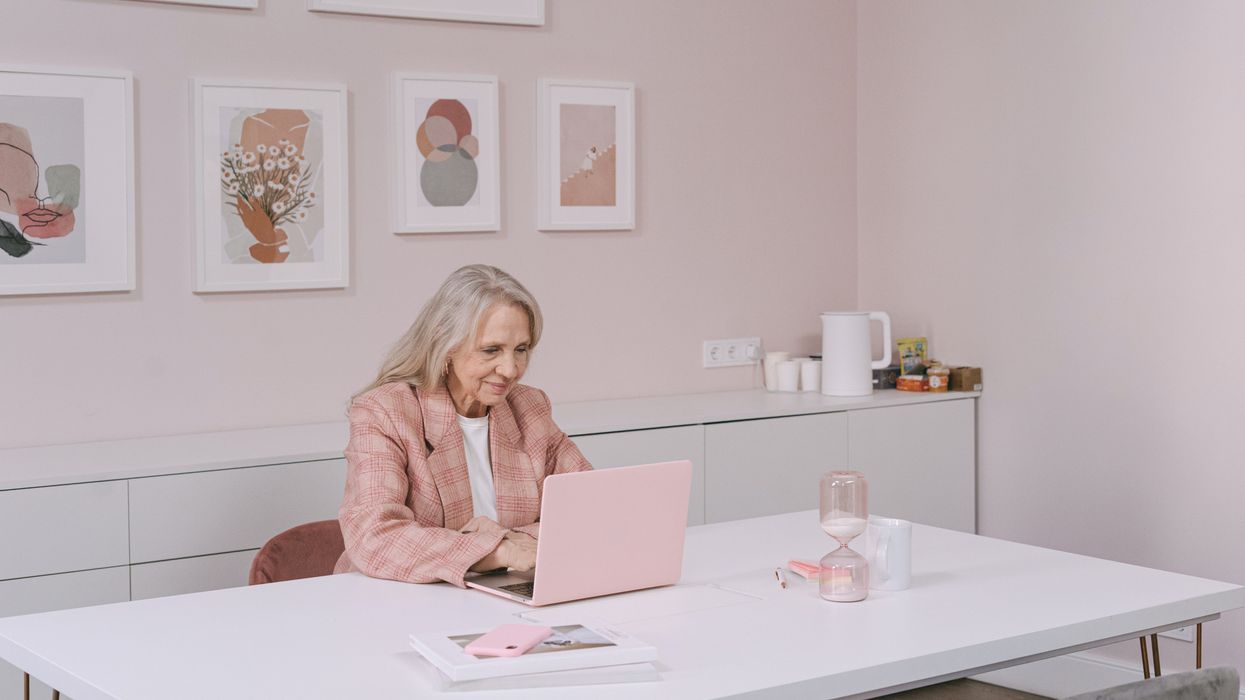 Pensioner looks at laptop