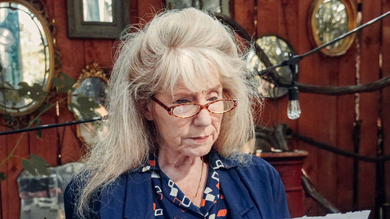 Pensioner looks at letter