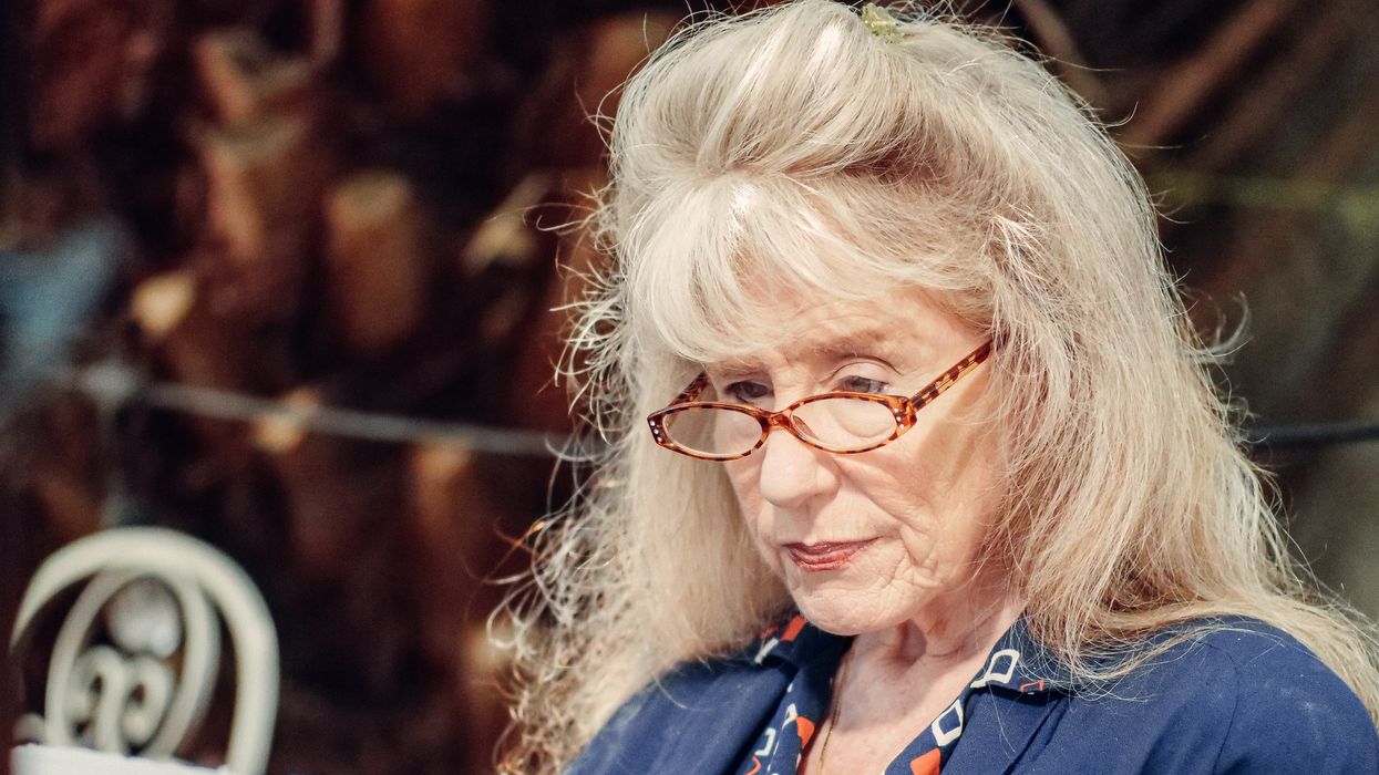 Pensioner looks at letter