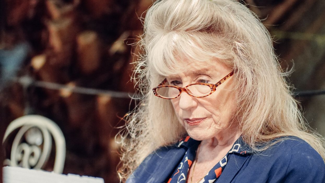 Pensioner looks at letter