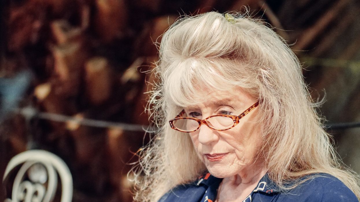 Pensioner looks at letter