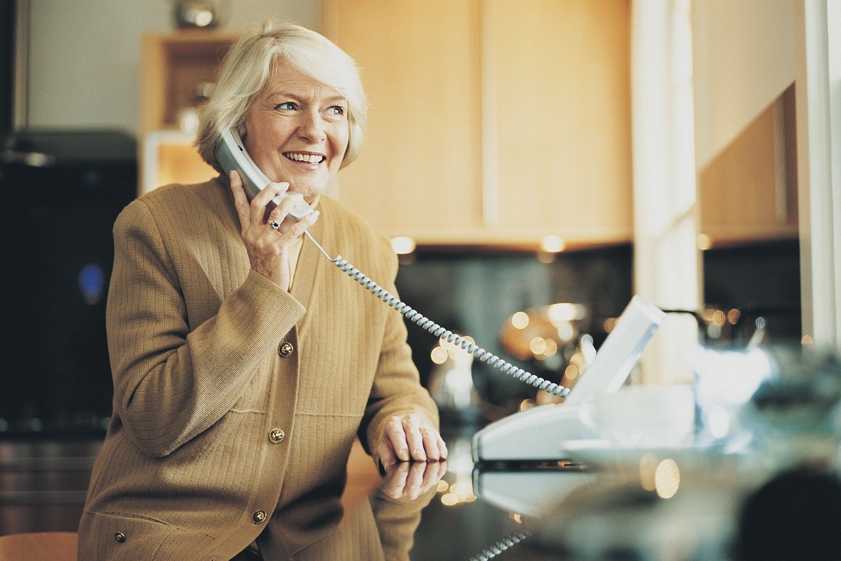 Pensioner on telephone