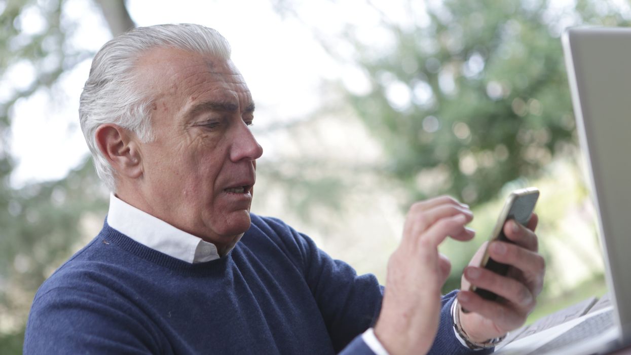 Pensioner uses mobile phone