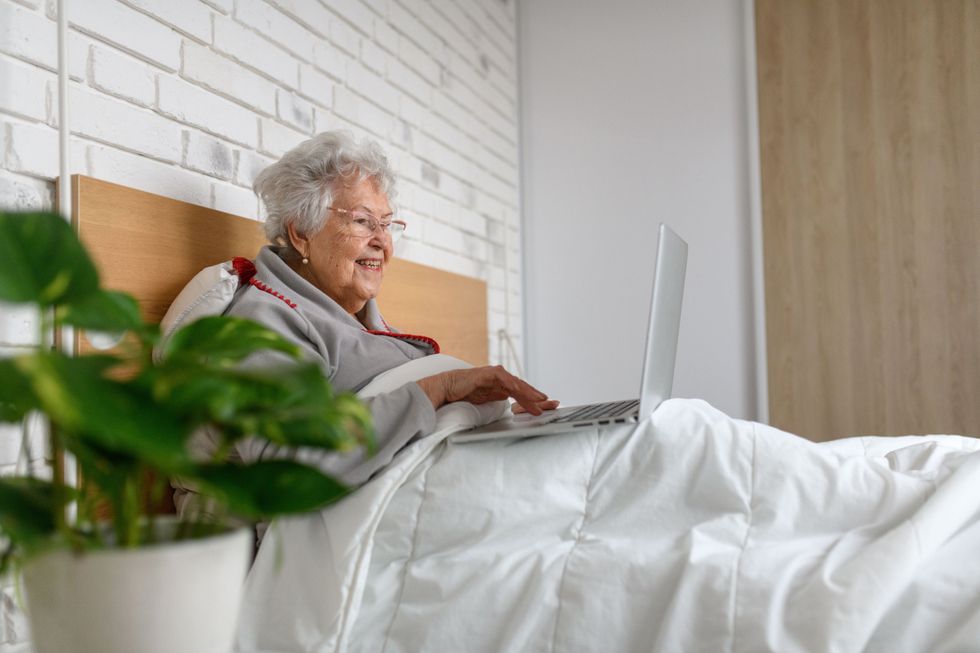 Pensioner using laptop
