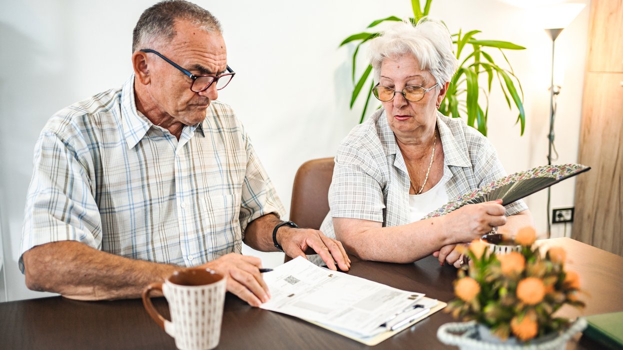Pensioners look at documents