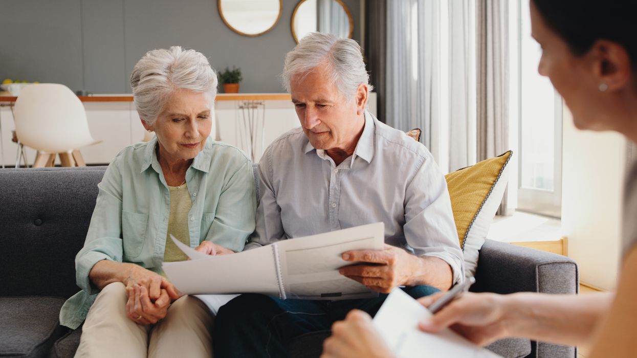 Pensioners look at documents