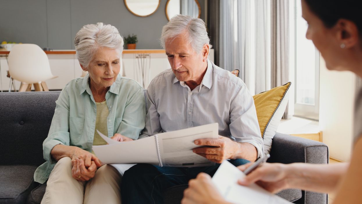 Pensioners look at documents