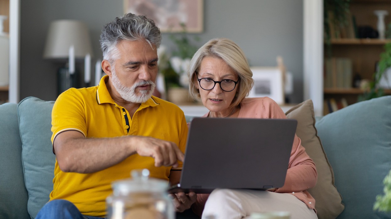 Pensioners look at laptop