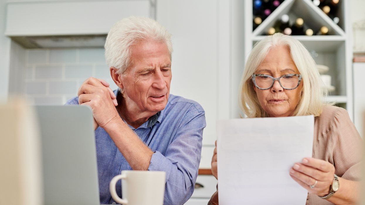 Pensioners look at tax letter in pictures