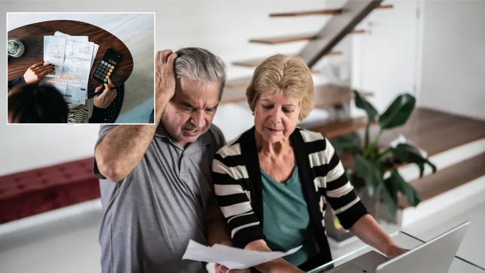 Pensioners looking at bills