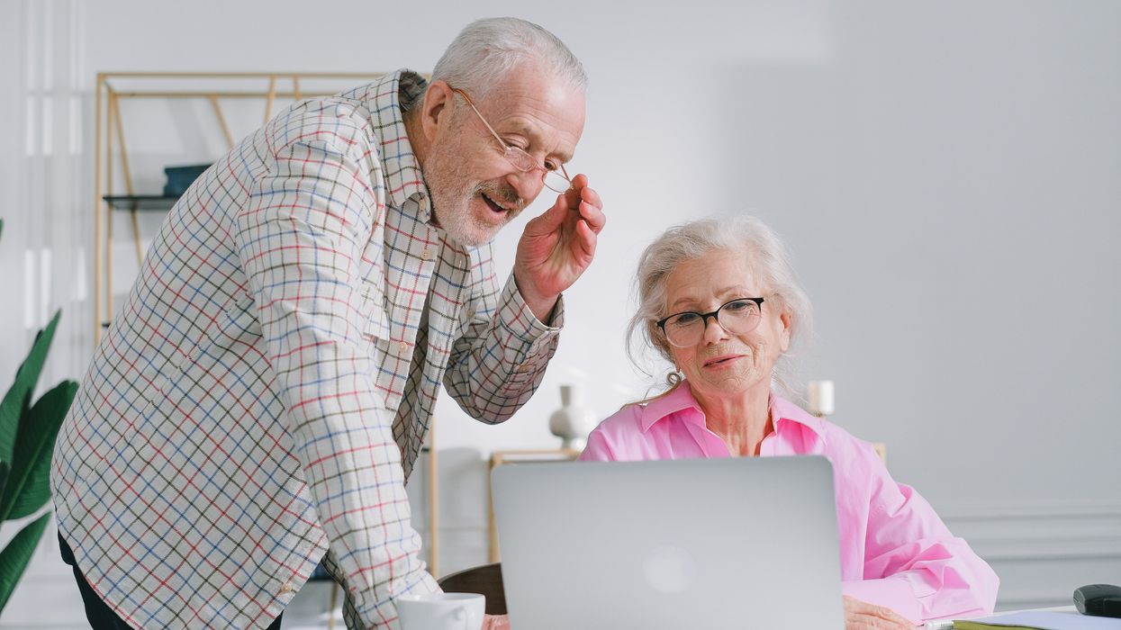 Pensioners looking at laptop
