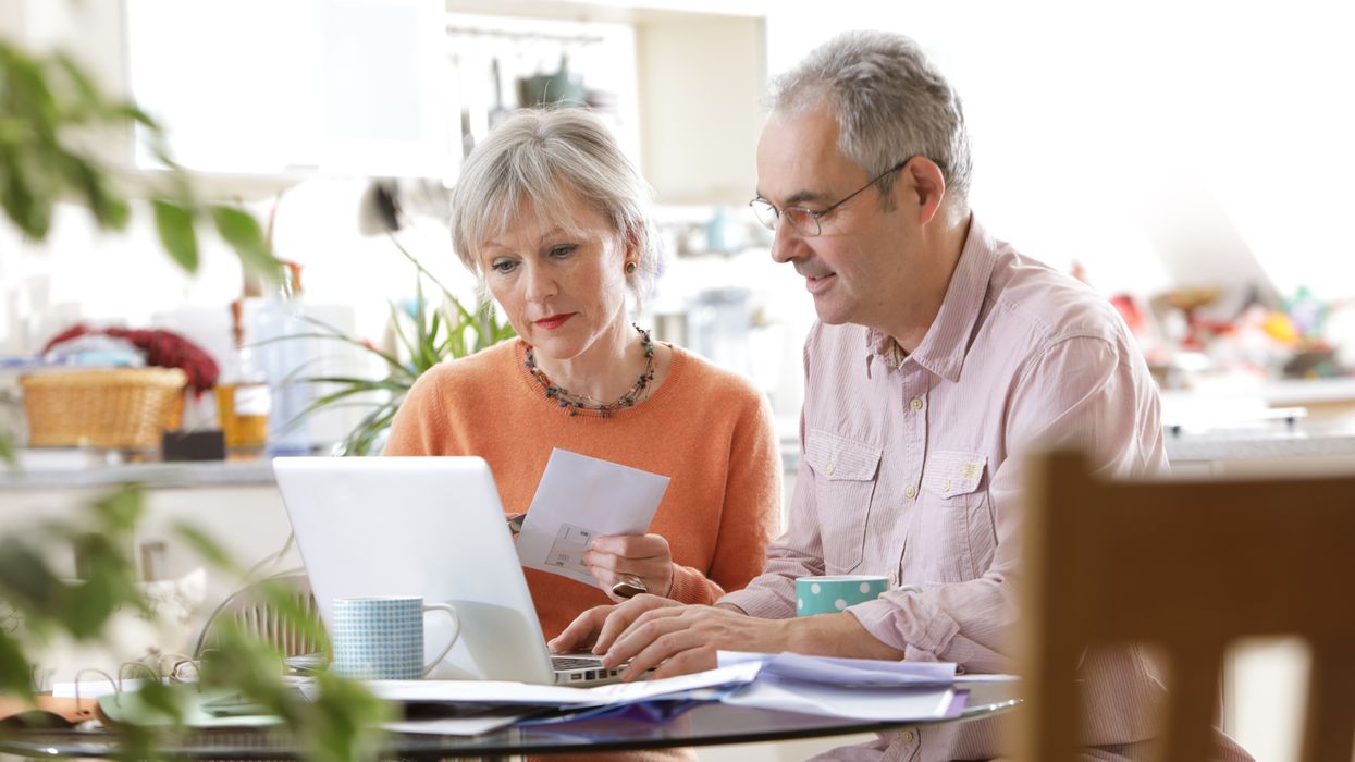 Pensioners looking on laptop for information