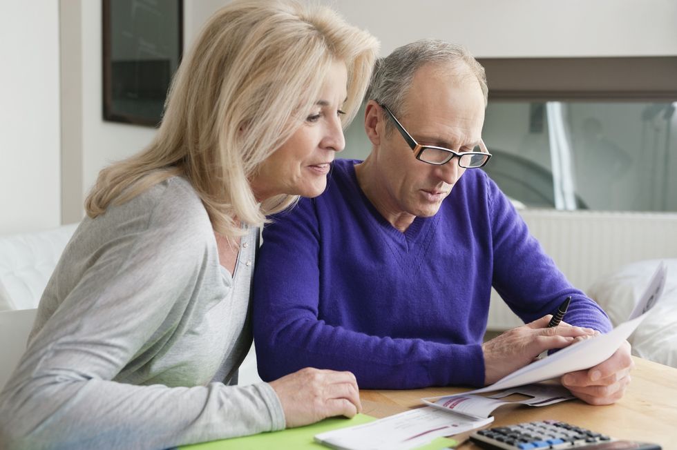 Pensioners reading documents