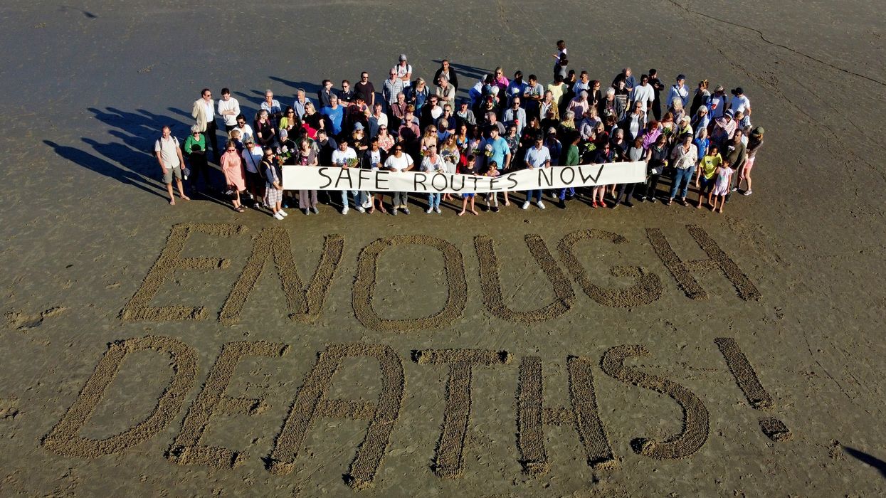 People at a vigil at Sunny Sands Beach in Folkestone for the migrants that died