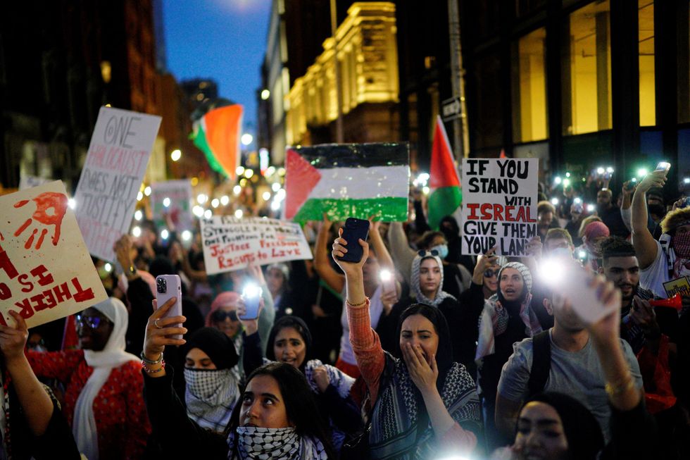 People attend a demonstration to express solidarity with Palestinians in Gaza