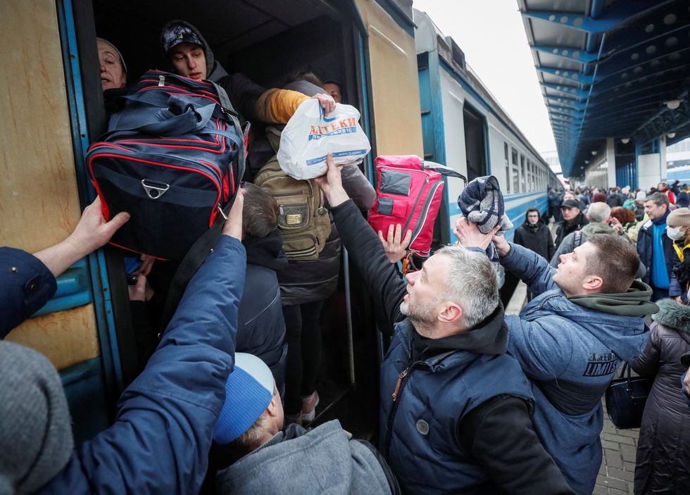 People board an evacuation train at Kyiv central train station in Kyiv