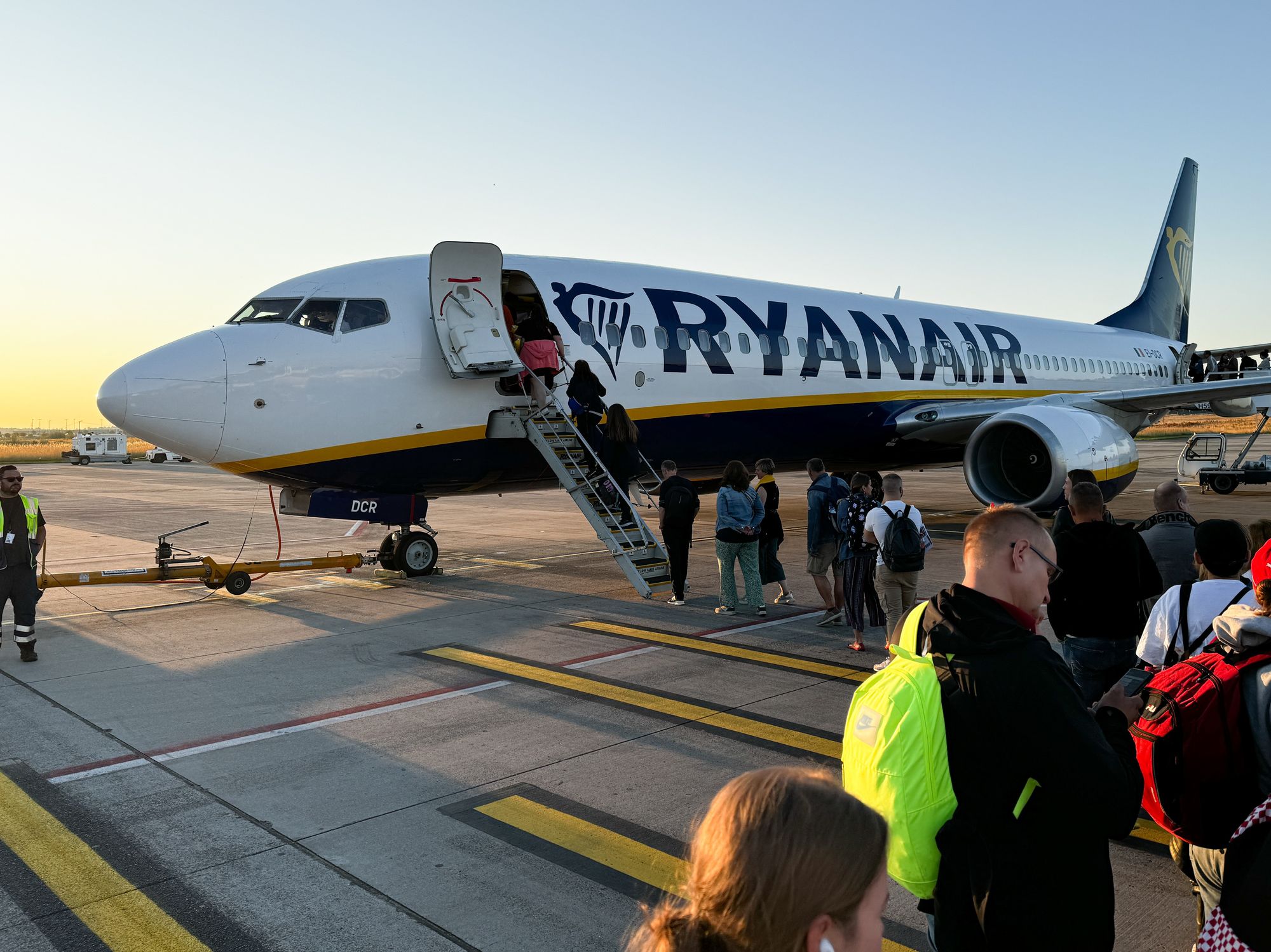 People board Ryanair plane at the airport