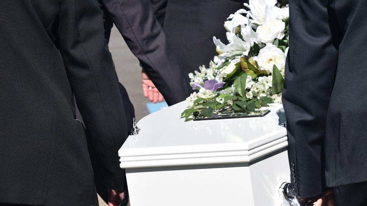 People carrying a coffin