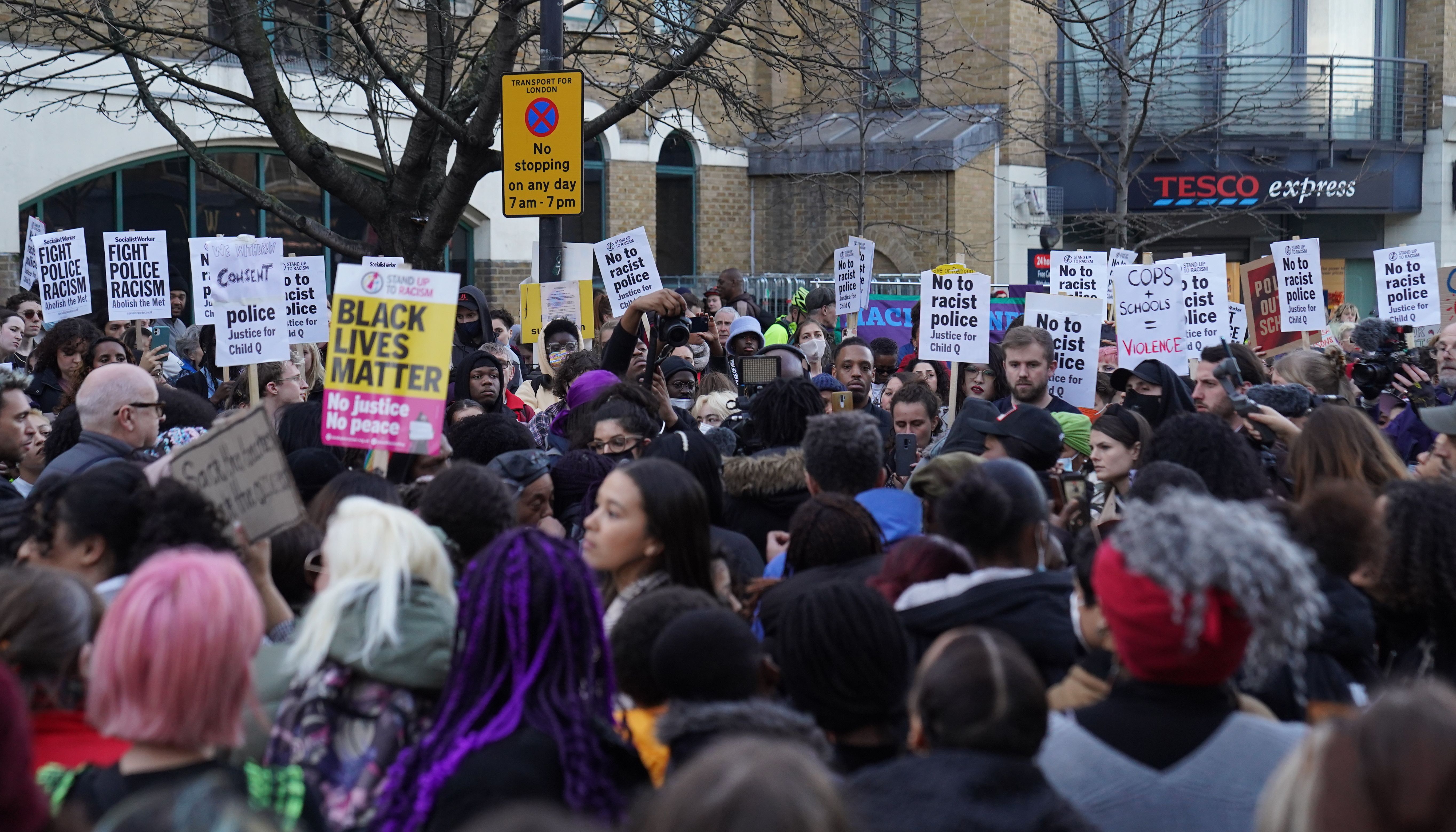 People demonstrate outside Stoke Newington Police Station in London, over the treatment of a black 15-year-old schoolgirl who was strip-searched by police while on her period. The secondary school pupil - referred to as Child Q - has launched civil proceedings against the Metropolitan Police over the search by two female officers, without another adult present, in 2020. Three police officers have been investigated for misconduct by the Independent Office for Police Conduct, which is finalising its report. Scotland Yard has apologised and said the incident %22should never have happened%22. Picture date: Friday March 18, 2022.