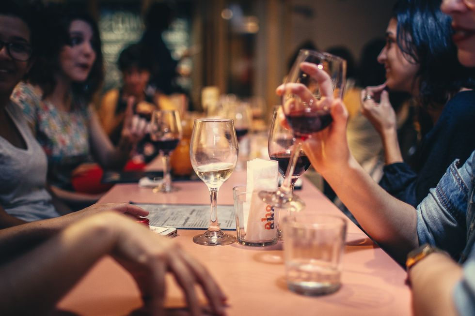 People drinking wine and alcohol at bar