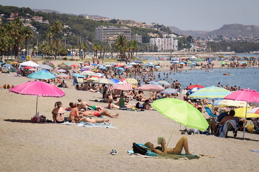 People enjoy the summer sun on the beach