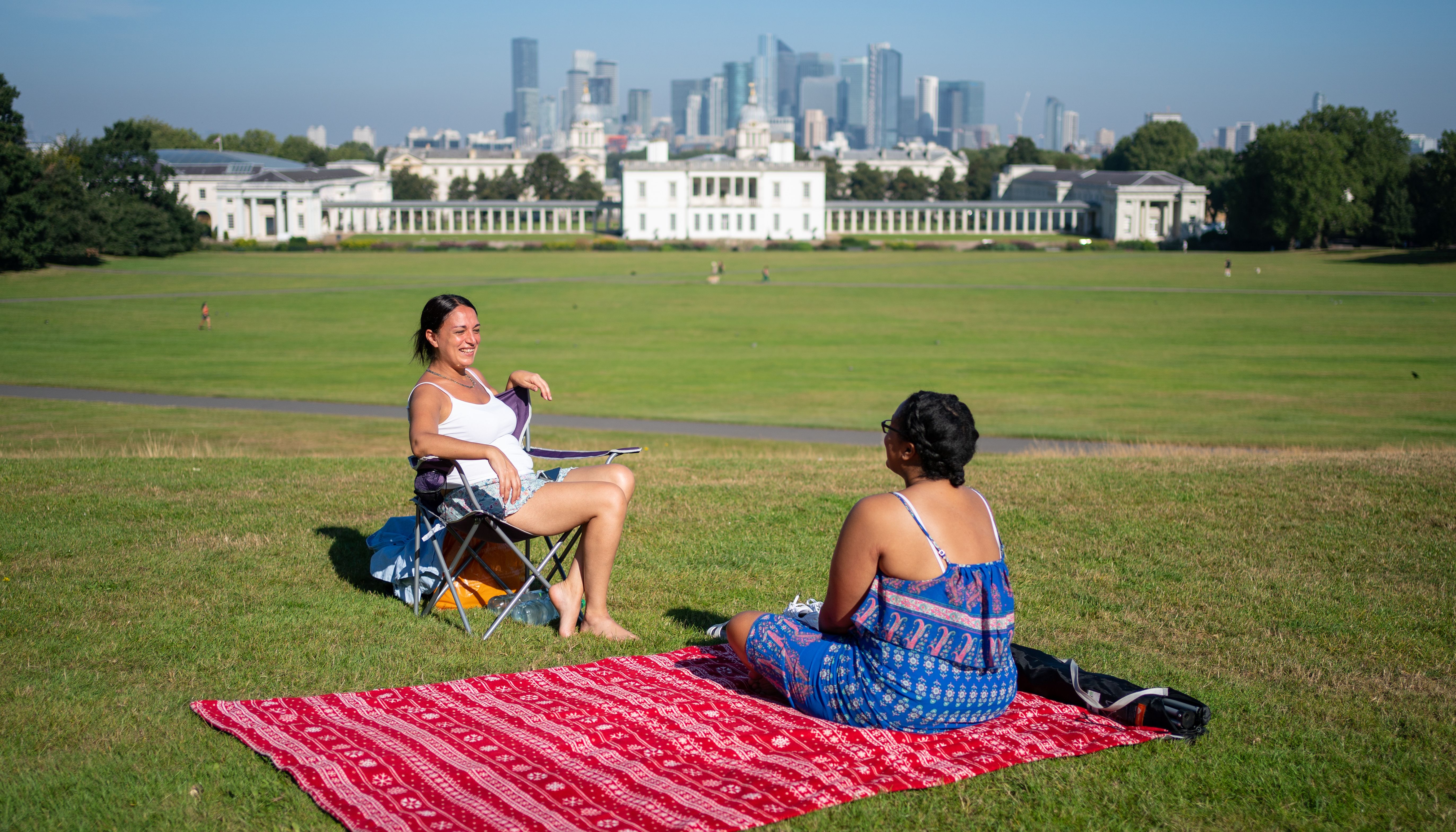 People enjoy the sun in Greenwich Park, London, as many parts of the UK are set for another day of high temperatures, as the warm start to September continues.