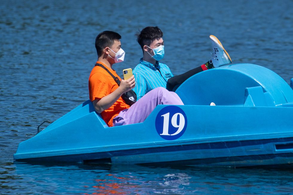 People enjoy the sun on the boat lake in Hyde Park, London, as temperatures are forecasted to soar over the weekend to reach highs of 31C (87.8F) on Sunday and Monday. Picture date: Friday July 16, 2021.