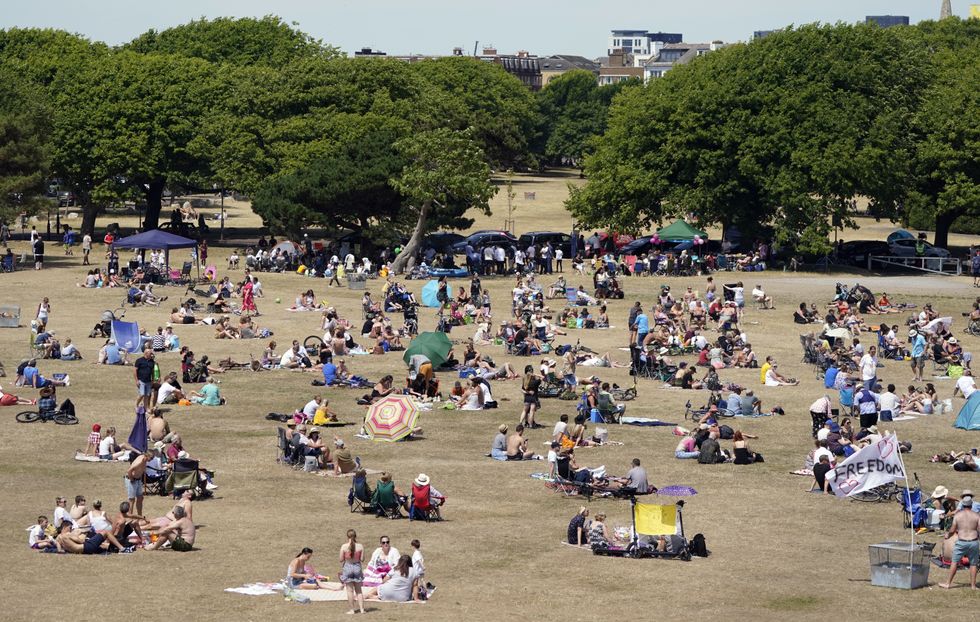 People enjoy the warm weather on Castle field in Southsea, Hampshire.