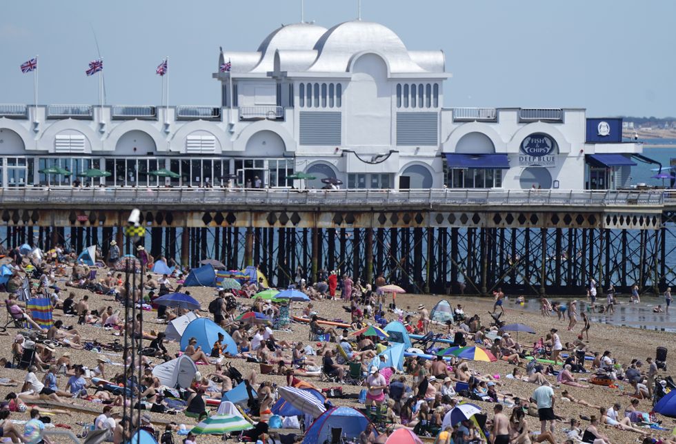 People enjoy the warm weather on Southsea beach in Hampshire