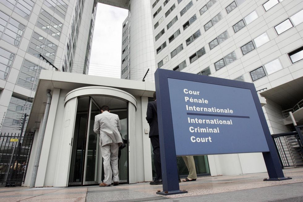 People enter the International Criminal Court, 20 June 2006 in the Hague