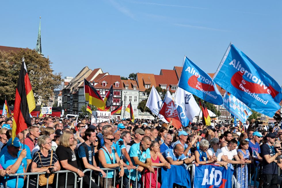 People gather at an election campaign rally of Alternative for Germany (AfD) party