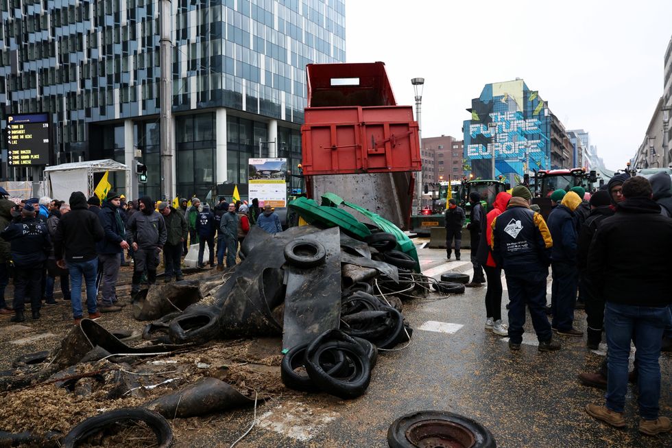 People gather during a protest of European farmers