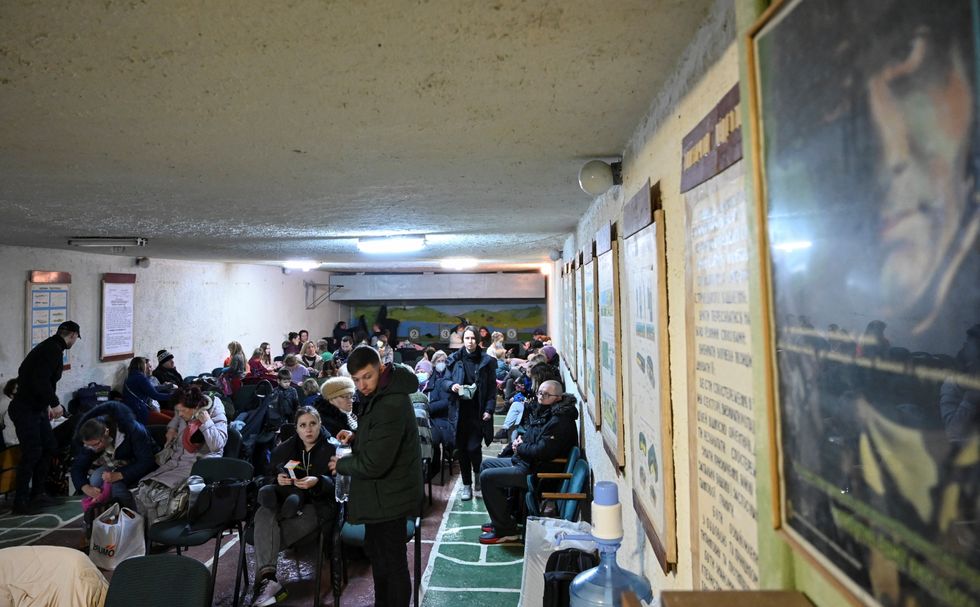 People gather in an air raid shelter in Kyiv, Ukraine February 24, 2022. Picture taken February 24, 2022. REUTERS/Viacheslav Ratynskyi