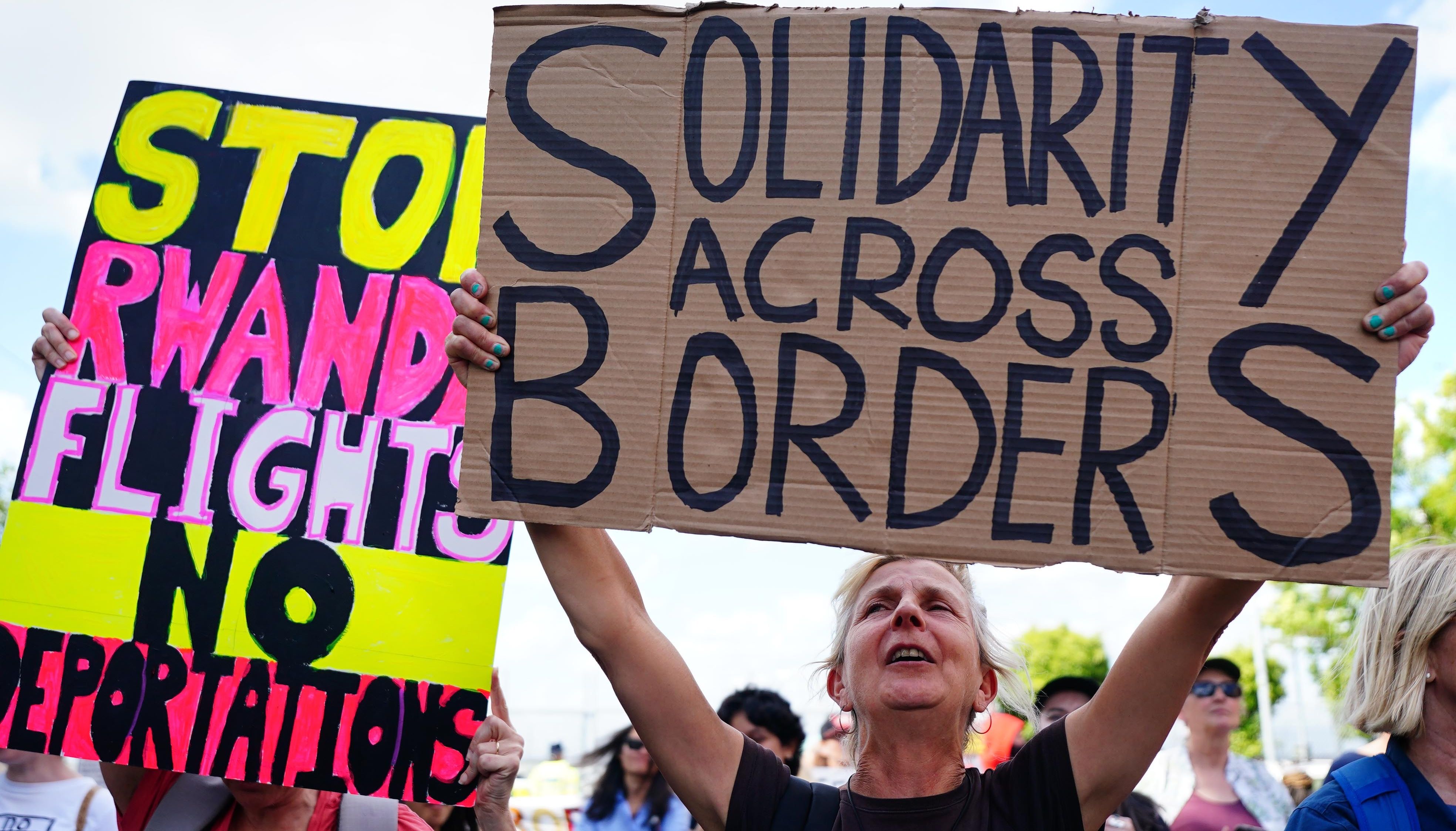 People have protested against the first migrant flight to Rwanda