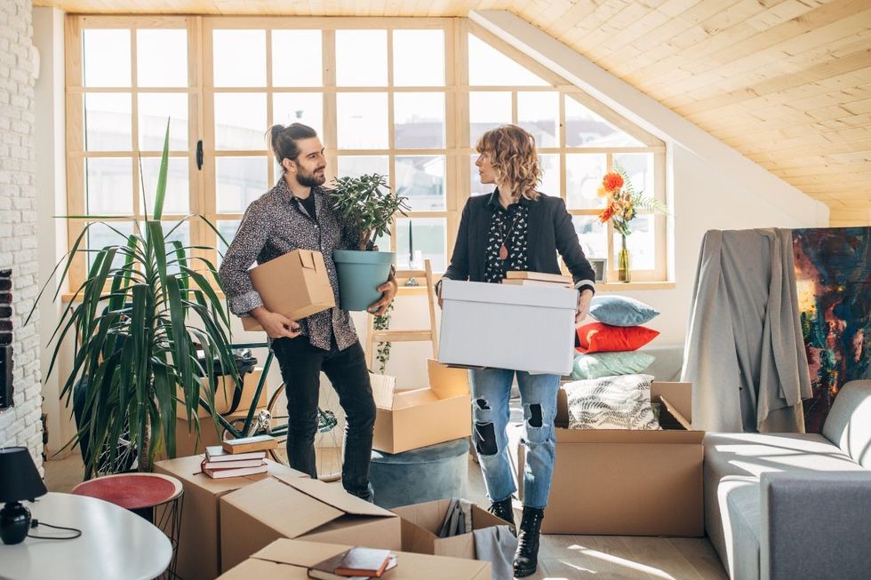 PEOPLE HOLDING BOXES