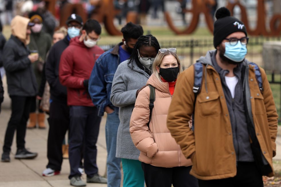 People in a line wearing masks