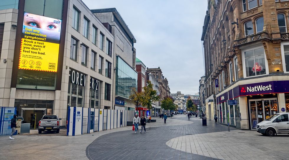 People in Liverpool city centre as England continues a four week national lockdown to curb the spread of coronavirus.