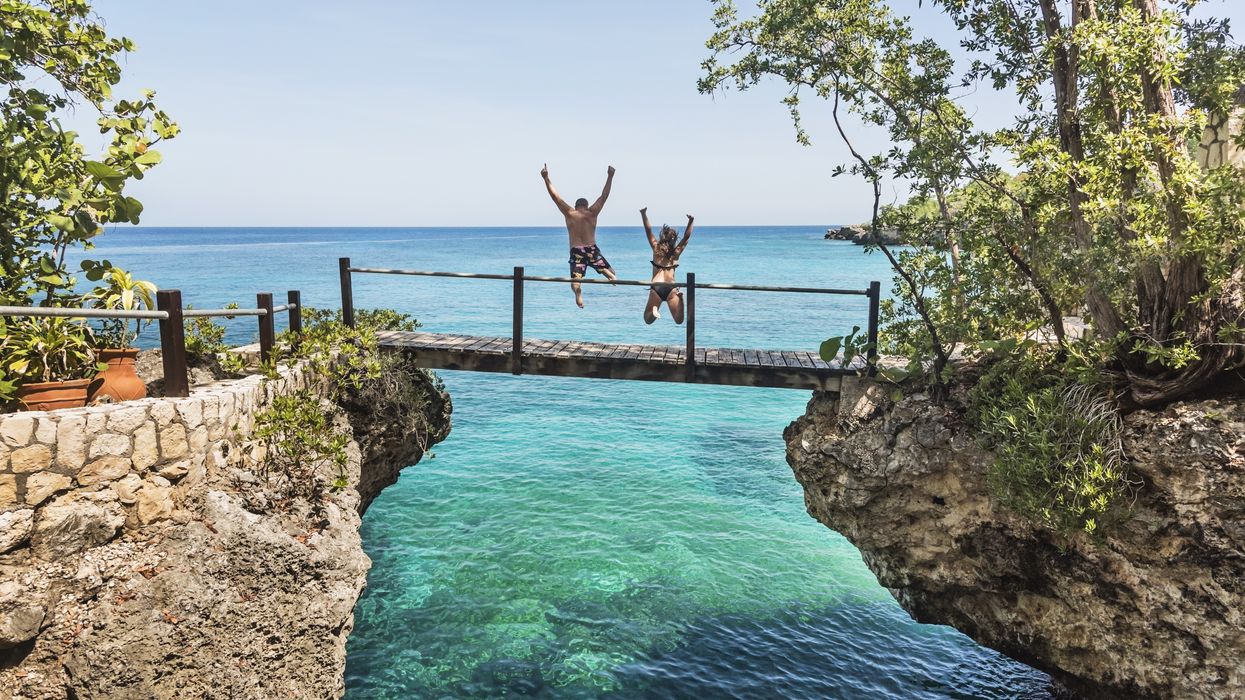 People jumping off bridge in Negril, Jamaica