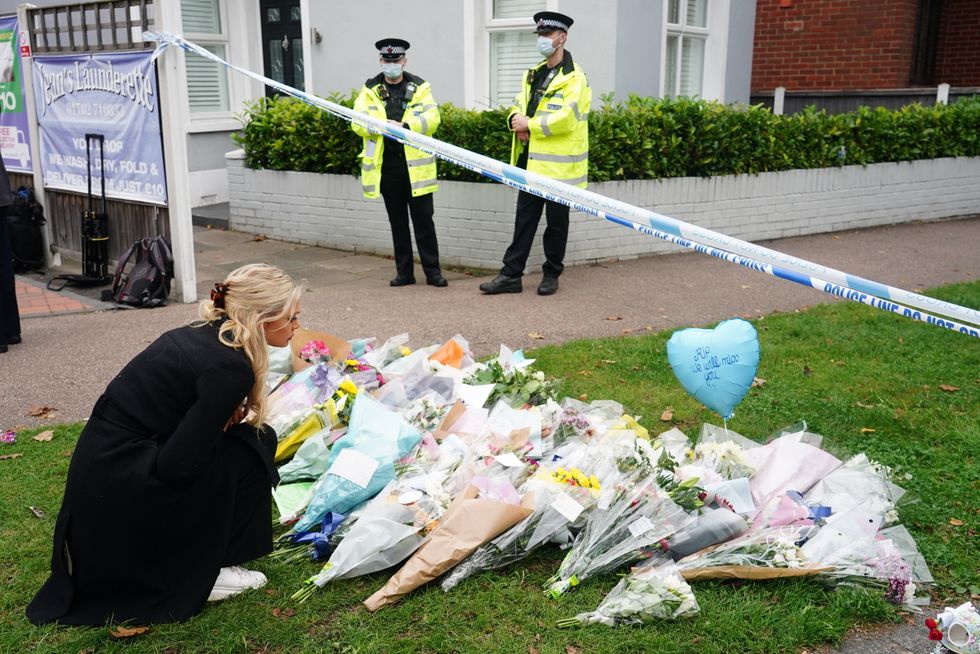 People leave flowers at the scene near Belfairs Methodist Church in Eastwood Road North, Leigh-on-Sea, Essex