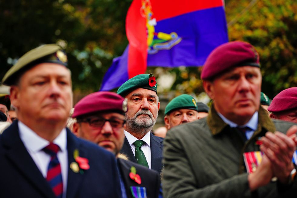 People line Royal Parade during the funeral of Dennis Hutchings.