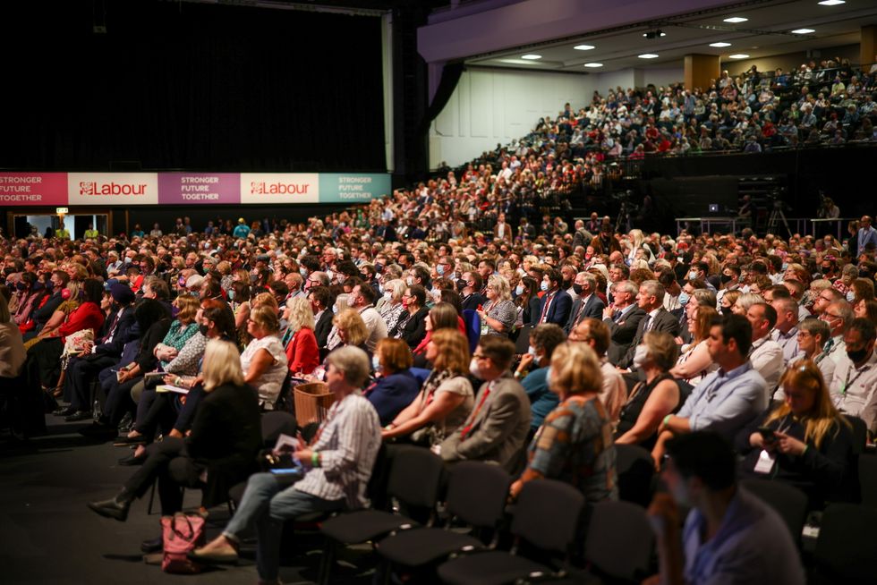 People listen during Britain's Labour Party annual conference, in Brighton.