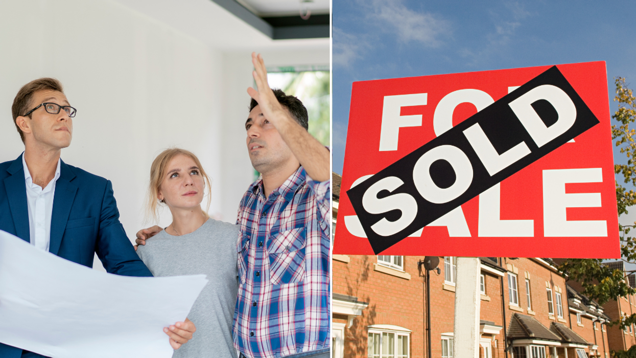 People looking at home / 'sold' for sale sign