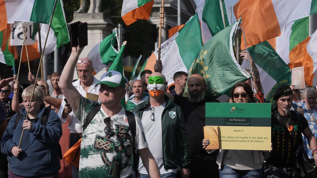 People march through Dublin city centre during an anti-immigration protest.