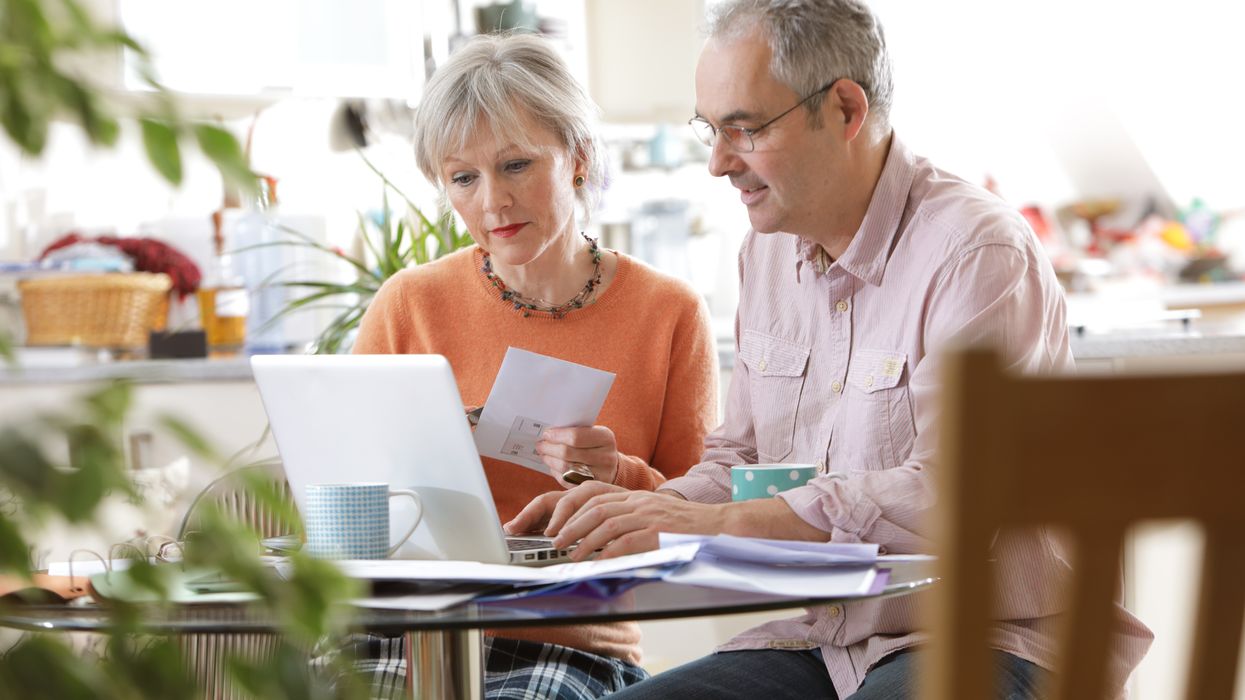 People nearing retirement looking on laptop for information